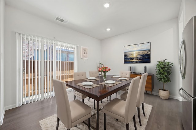 dining area with wood-type flooring