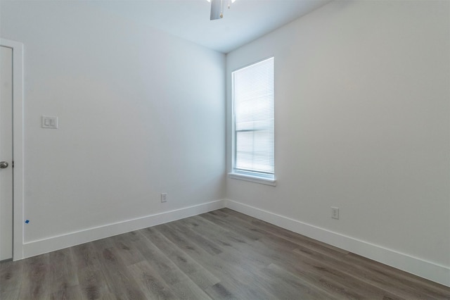 unfurnished room featuring hardwood / wood-style flooring