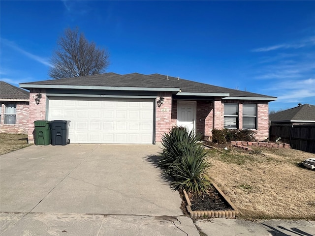 single story home featuring an attached garage, brick siding, a shingled roof, fence, and concrete driveway