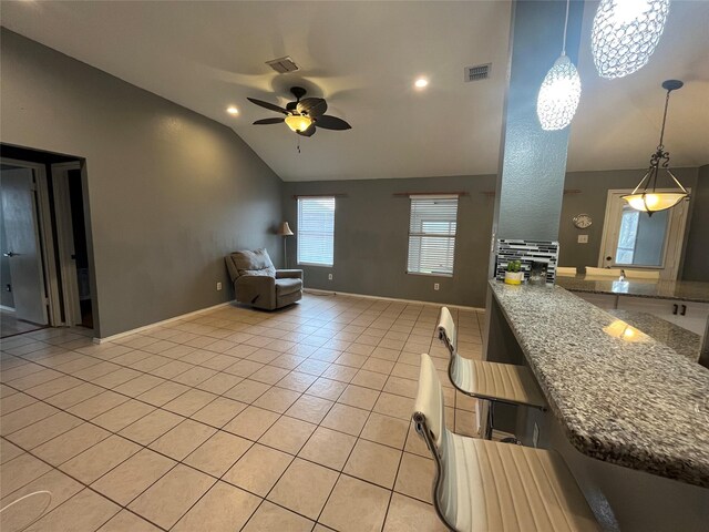 tiled living room featuring ceiling fan