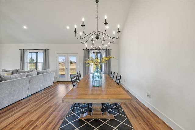 dining room with french doors and hardwood / wood-style floors