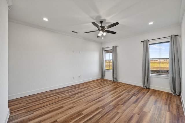 unfurnished room featuring wood-type flooring, ceiling fan, and crown molding