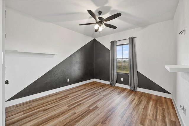 additional living space featuring ceiling fan and hardwood / wood-style floors