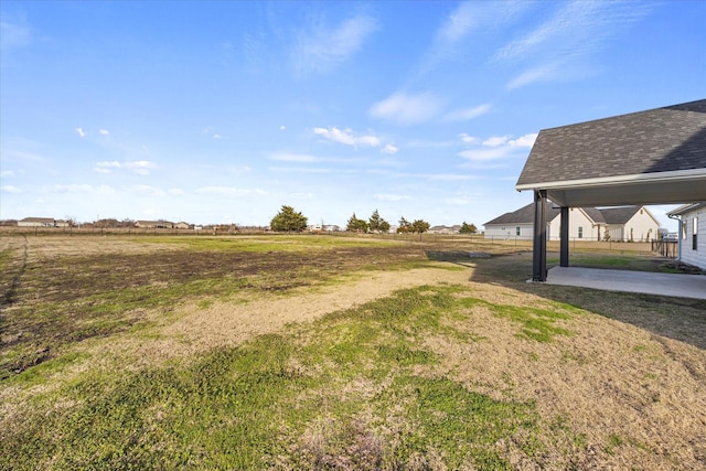 view of yard with a patio area and a rural view