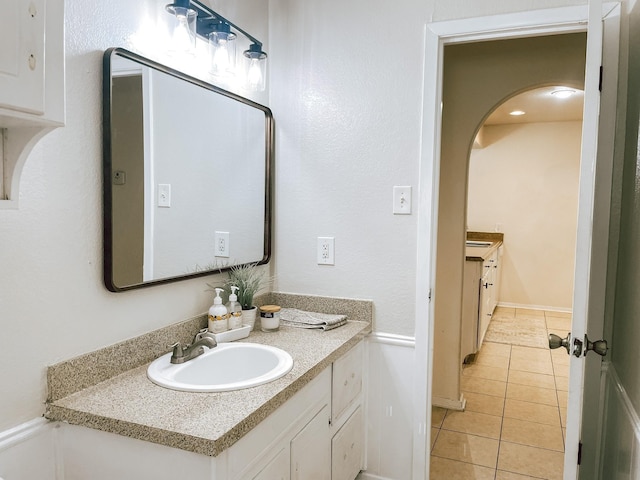 bathroom with vanity and tile patterned floors