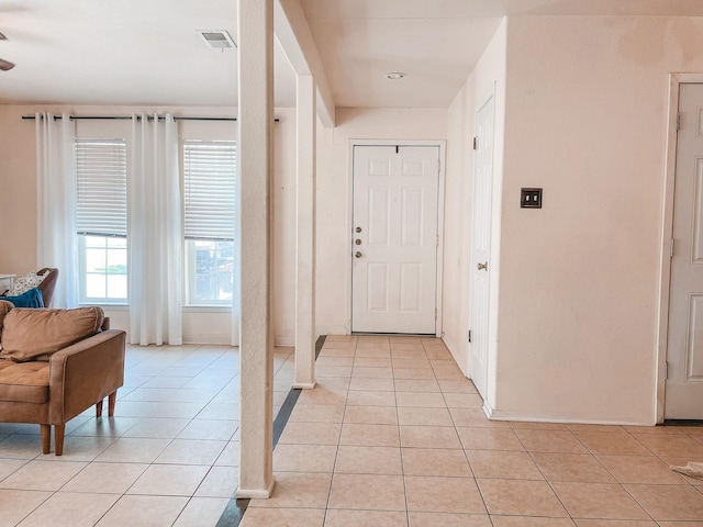 foyer entrance featuring light tile patterned flooring