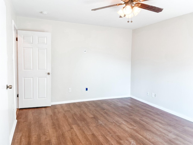 unfurnished room featuring ceiling fan and hardwood / wood-style flooring