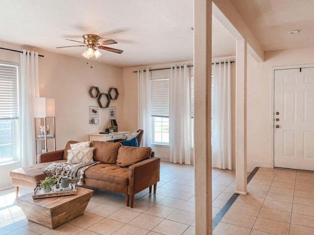 living room with light tile patterned flooring and ceiling fan