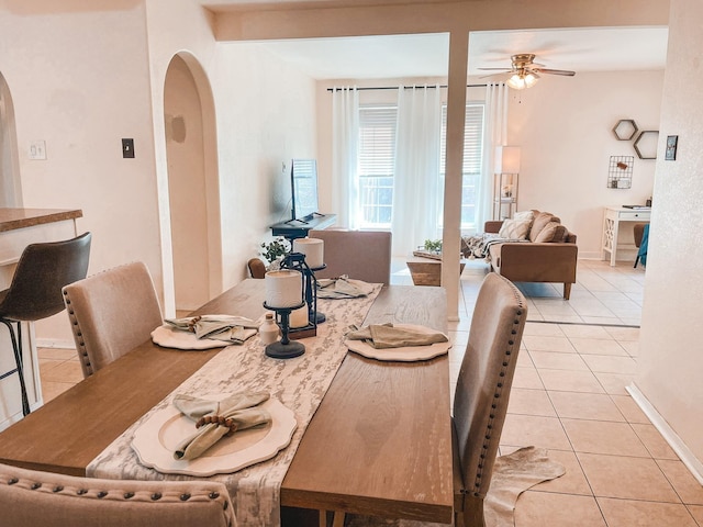 dining area featuring ceiling fan and light tile patterned floors