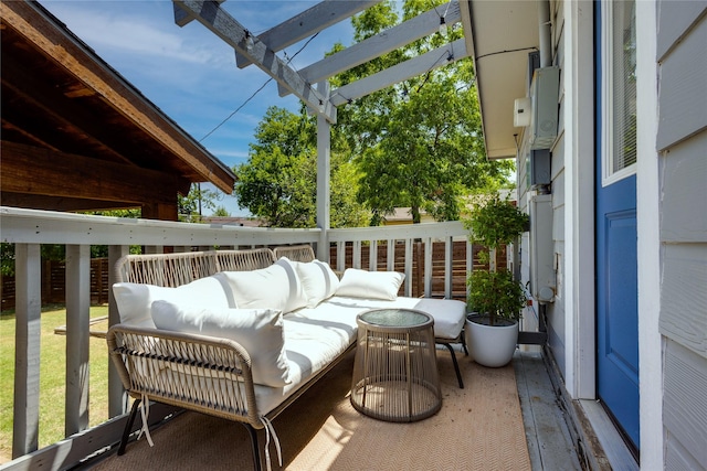 wooden balcony featuring a pergola and a wooden deck