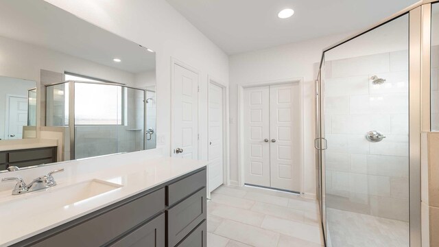 9328 Paintbrush Dr, Oak Point, TX 75068 - bathroom with a shower stall, vanity, and recessed lighting