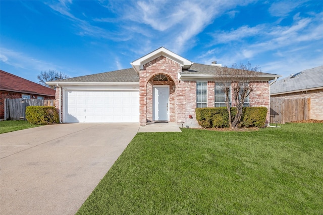 view of front of property featuring a garage and a front lawn