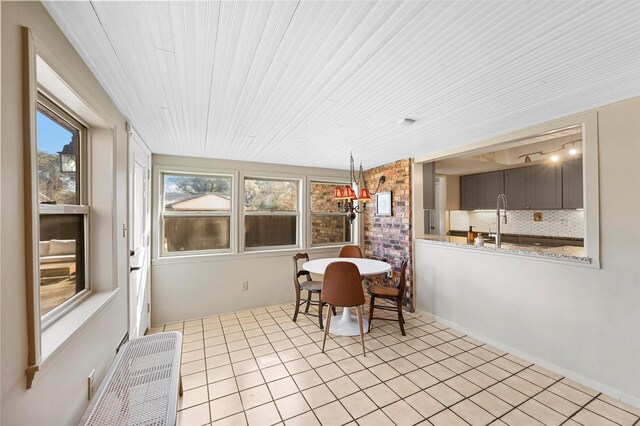 dining area featuring light tile patterned floors