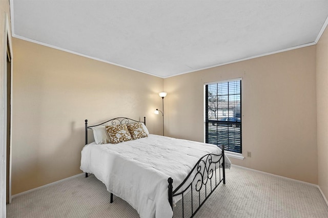 bedroom featuring crown molding and light colored carpet