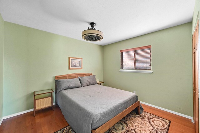 bedroom featuring wood-type flooring