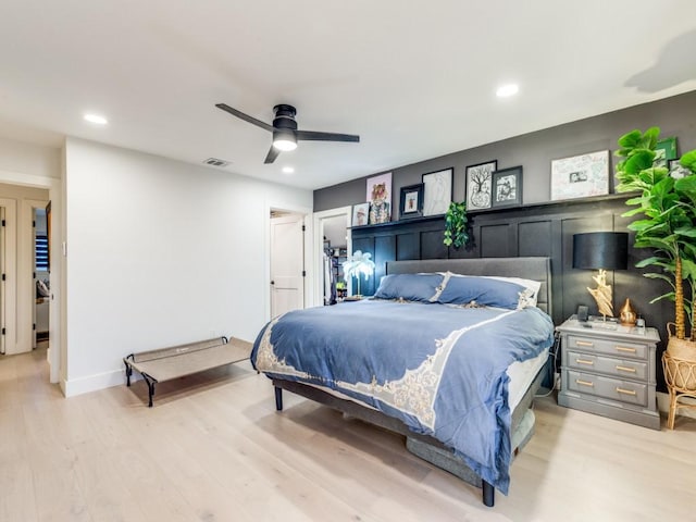 bedroom featuring ceiling fan and light hardwood / wood-style floors