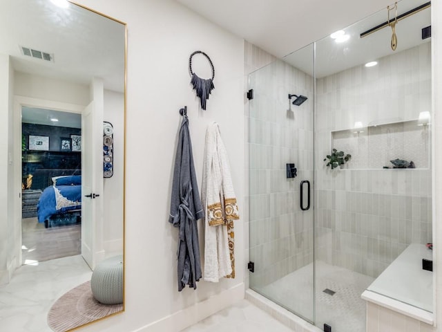 bathroom featuring an enclosed shower