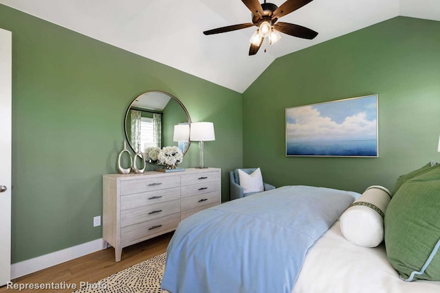 bedroom featuring lofted ceiling, ceiling fan, and light hardwood / wood-style floors