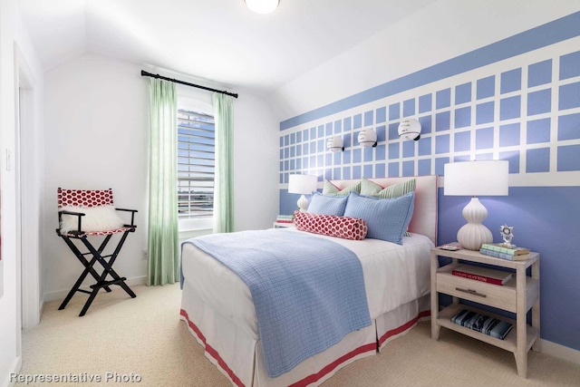 carpeted bedroom with lofted ceiling