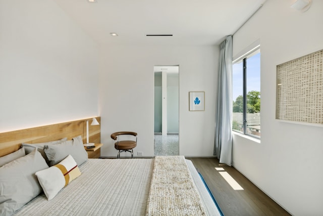 bedroom with wood-type flooring