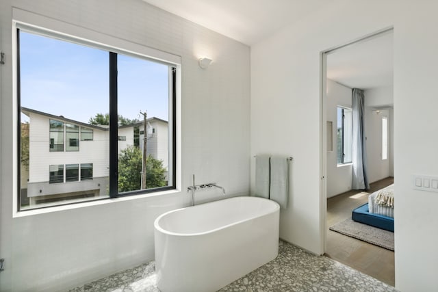 bathroom featuring a tub to relax in