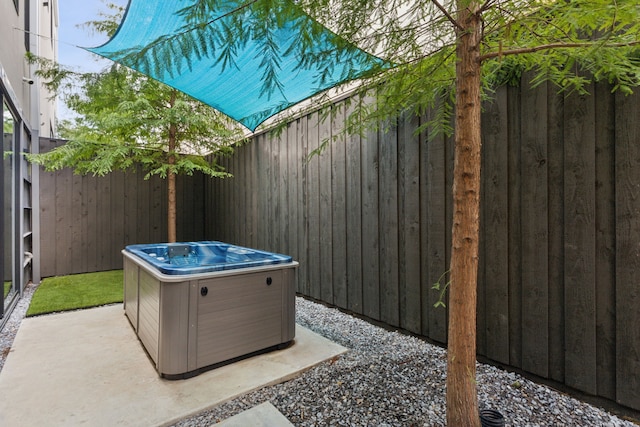 view of patio / terrace featuring a hot tub