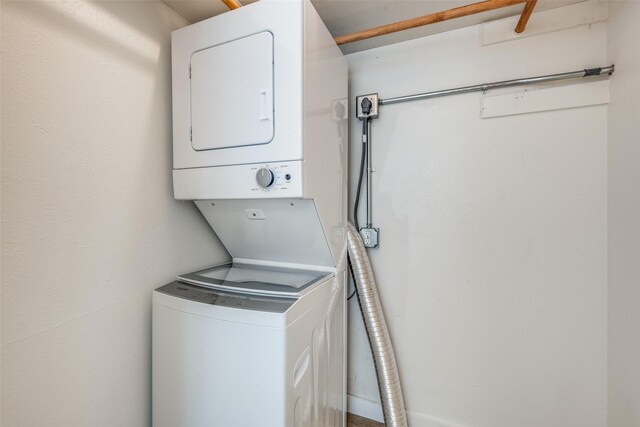 washroom with stacked washer and dryer