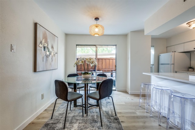 dining room with light wood-type flooring