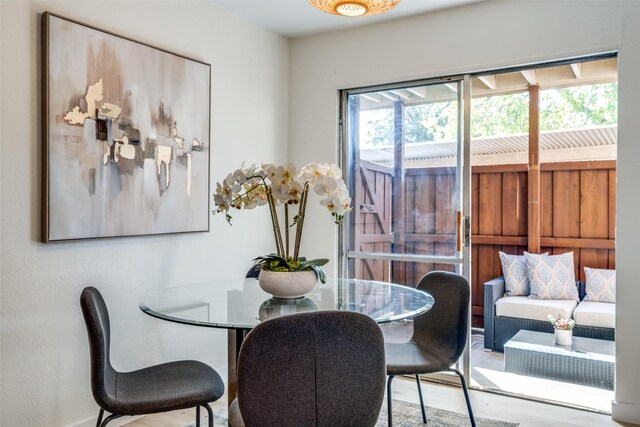 dining area with light wood-type flooring