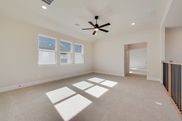 empty room featuring light colored carpet and ceiling fan