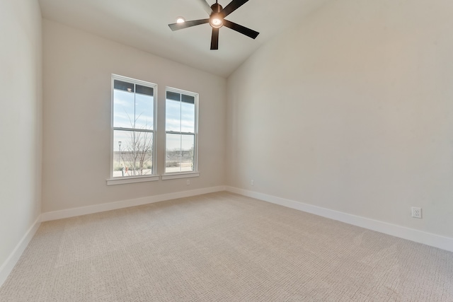 unfurnished room featuring lofted ceiling, light carpet, and ceiling fan