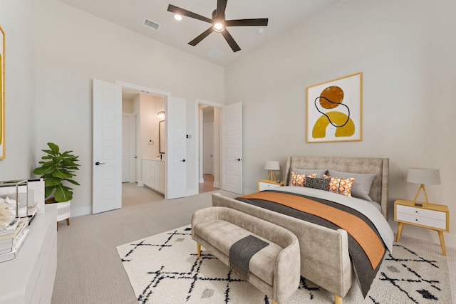 bedroom featuring ceiling fan and light carpet