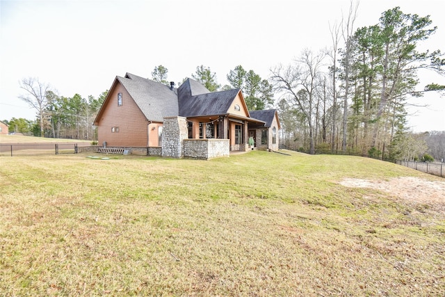 view of property exterior featuring a lawn