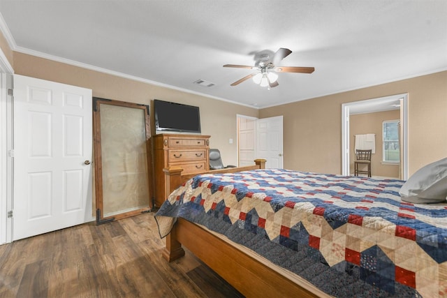 bedroom with ceiling fan, crown molding, and dark hardwood / wood-style floors