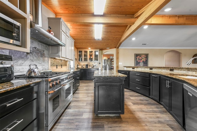 kitchen featuring stainless steel appliances, a center island, wooden ceiling, and wall chimney exhaust hood