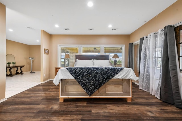 bedroom featuring dark hardwood / wood-style flooring