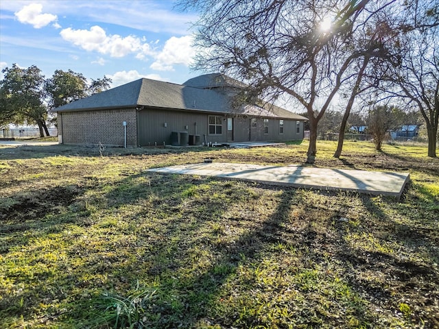 view of yard featuring a patio area and central AC