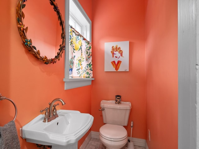 bathroom featuring sink and toilet