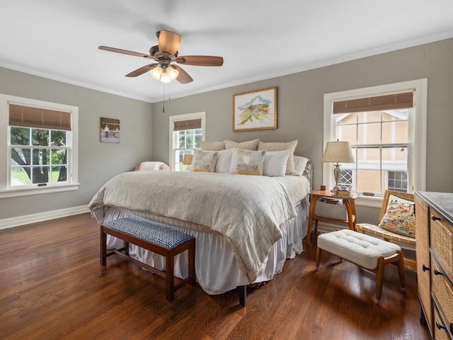 bedroom with dark wood-type flooring, ceiling fan, and crown molding