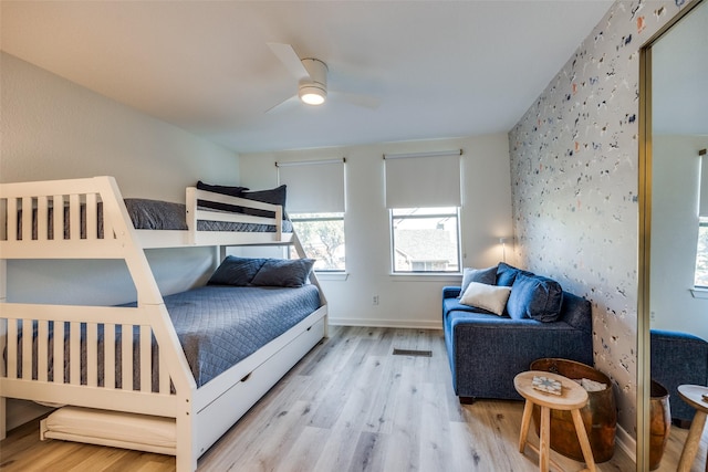 bedroom featuring ceiling fan and light wood-type flooring