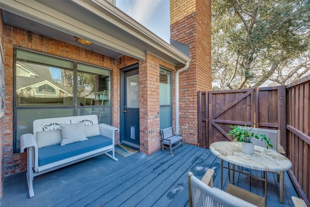 wooden deck featuring an outdoor living space