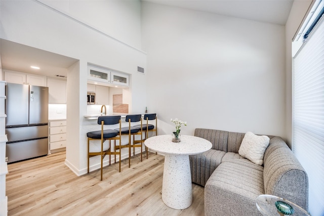 living room with light hardwood / wood-style flooring