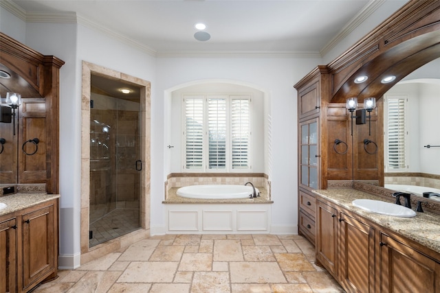 bathroom with crown molding, independent shower and bath, and vanity