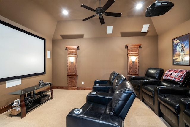 home theater room featuring ceiling fan, carpet, and lofted ceiling