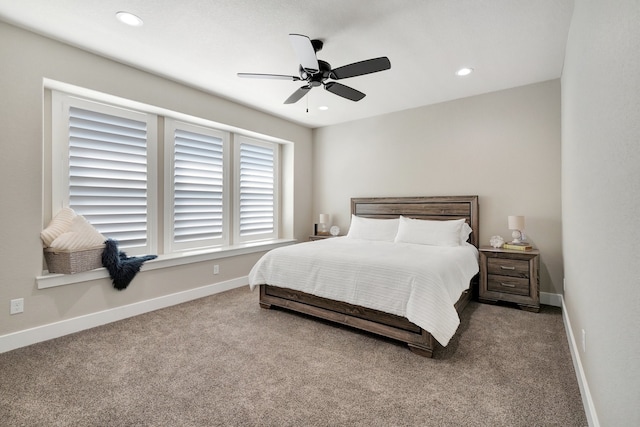 bedroom featuring ceiling fan and carpet