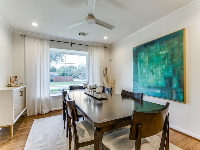 dining room featuring ceiling fan, hardwood / wood-style floors, and crown molding