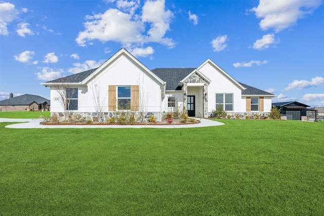 modern farmhouse style home with a front yard