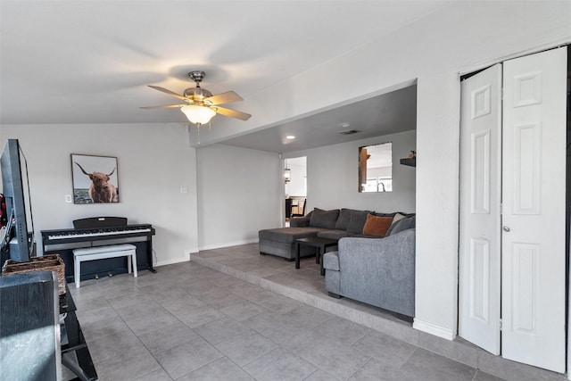 living room with ceiling fan and light tile patterned floors