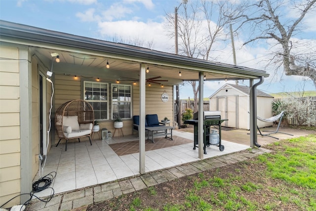 view of patio / terrace featuring grilling area and a shed