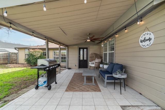 view of patio with grilling area, ceiling fan, and an outdoor living space